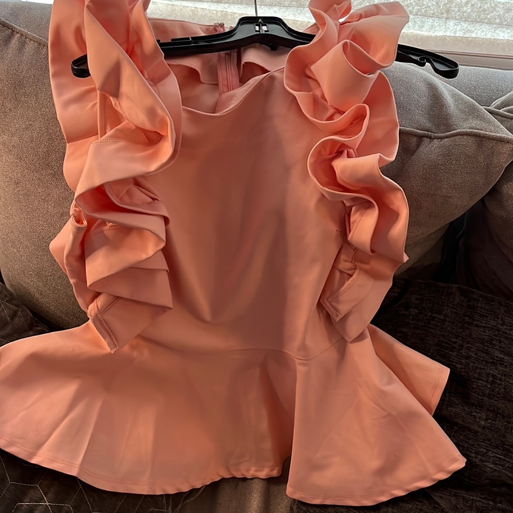 Ladies peplum, ruffle blouse.